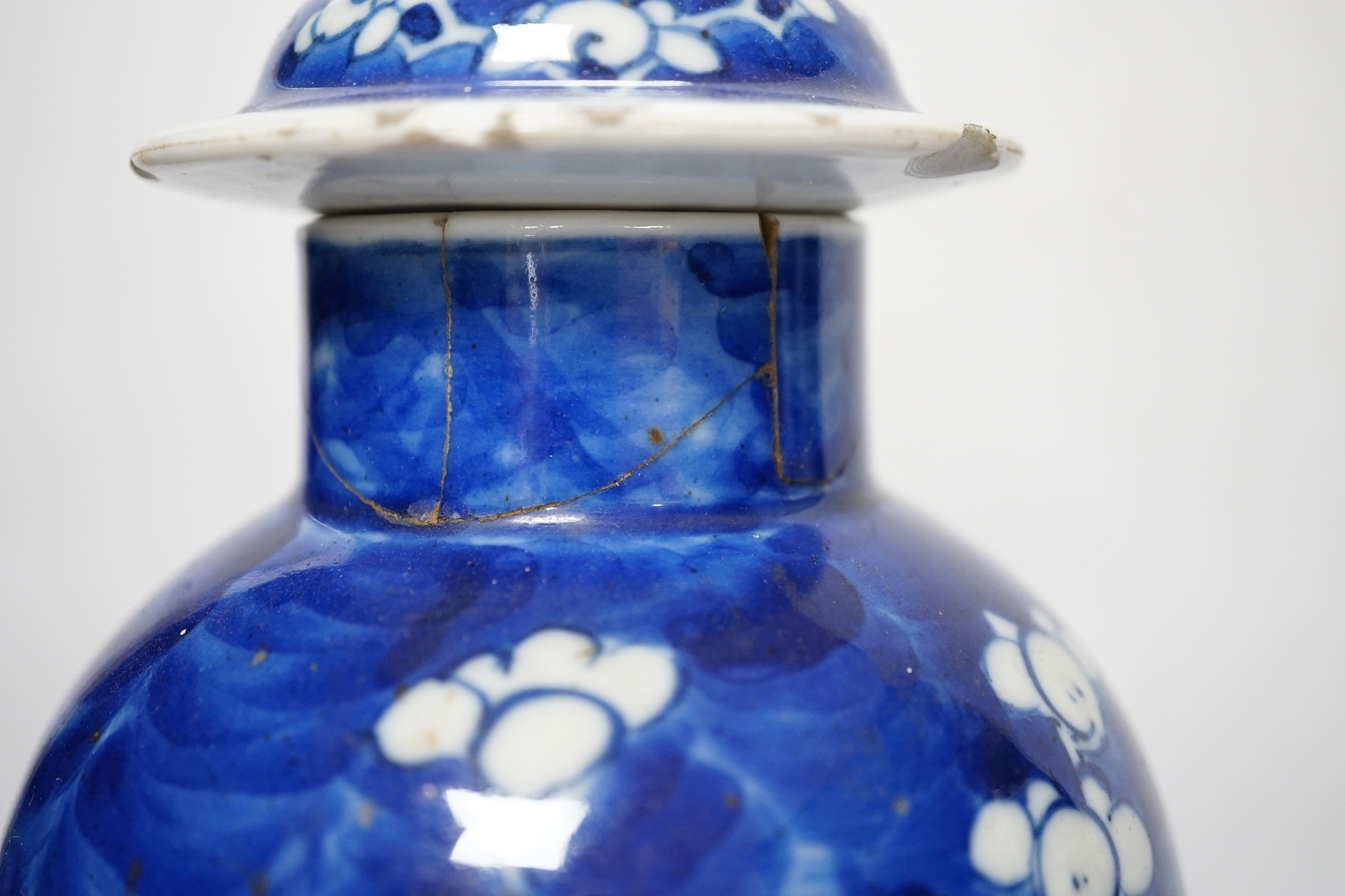 Five early 20th century Chinese blue and white prunus vases and covers, tallest 31cm